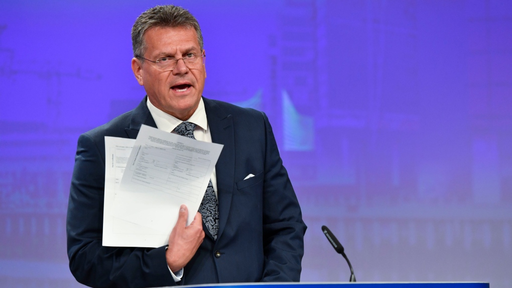 European Commissioner for Inter-institutional Relations and Foresight Maros Sefcovic holds up documents as he speaks during a media conference at EU headquarters in Brussels, Wednesday, June 15, 2022. (AP Photo/Geert Vanden Wijngaert)