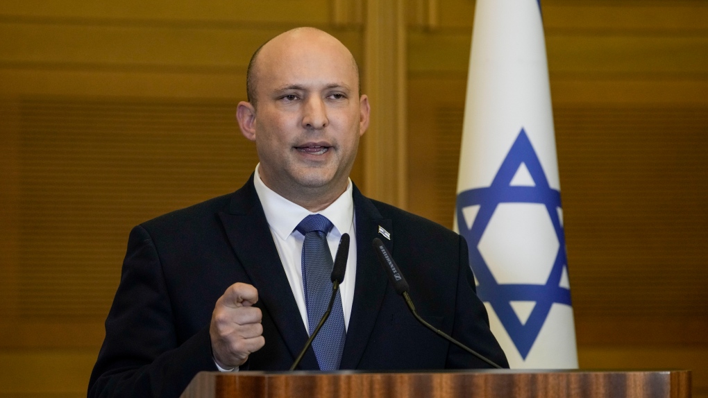 Israeli Prime Minister Naftali Bennett delivers a statement at the Knesset, Israel's parliament, in Jerusalem, Wednesday, June 29, 2022. (AP Photo/Tsafrir Abayov)