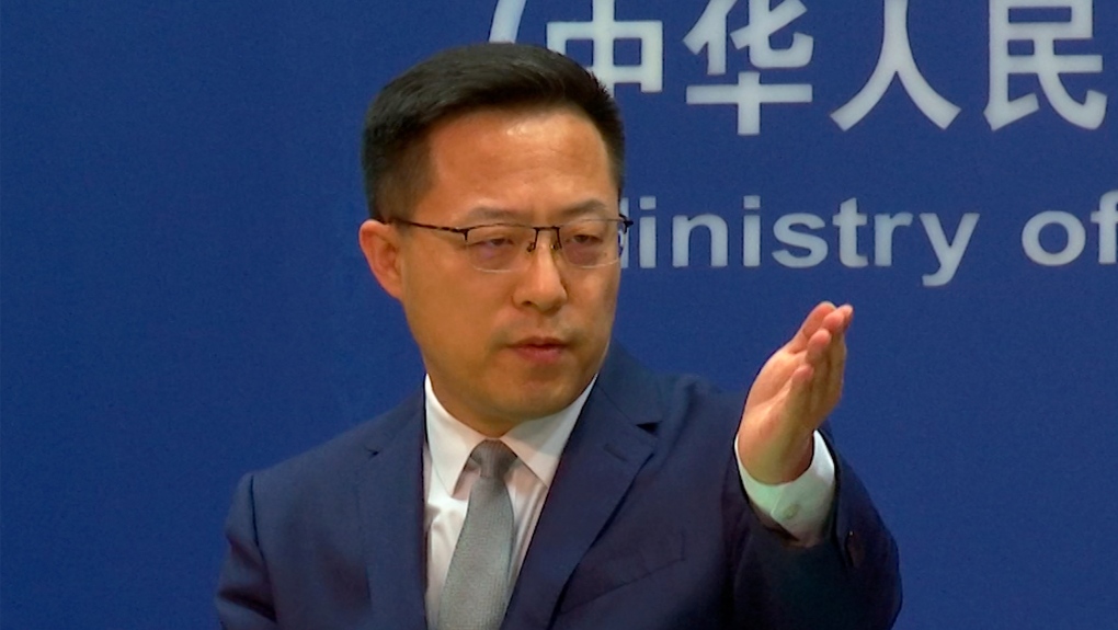 In this image made from video, Chinese Foreign Ministry spokesperson Zhao Lijian gestures during a media briefing at the Ministry of Foreign Affairs office, April 6, 2022, in Beijing. (AP Photo/Liu Zheng)
