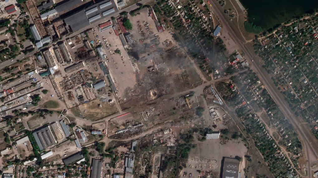 This satellite image from Planet Labs PBC shows the aftermath of a Ukrainian strike on a Russian ammunition depot in Nova Kakhovka, Ukraine, July 12, 2022. (Planet Labs PBC via AP)