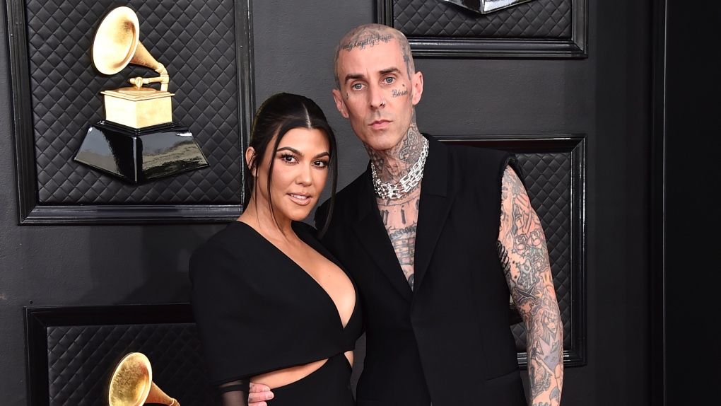 Kourtney Kardashian, left, and Travis Barker appear at the 64th Annual Grammy Awards in Las Vegas on April 3, 2022. (Photo by Jordan Strauss/Invision/AP, File)
