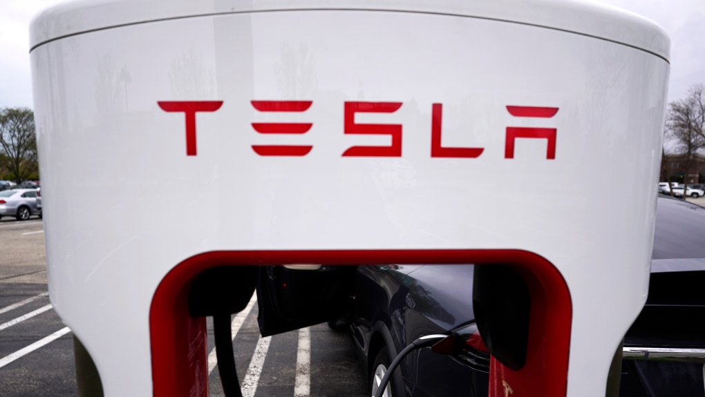 Tesla Supercharger is seen at Willow Festival shopping plaza parking lot in Northbrook, Ill., Thursday, May 5, 2022. (AP Photo/Nam Y. Huh)