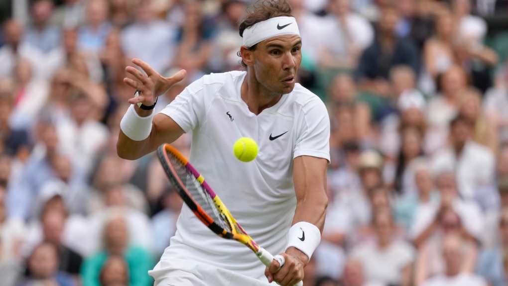 Spain's Rafael Nadal returns to Taylor Fritz of the U.S. in a men's singles quarterfinal match on Day 10 of the Wimbledon tennis championships in London, July 6, 2022. (AP Photo/Kirsty Wigglesworth)