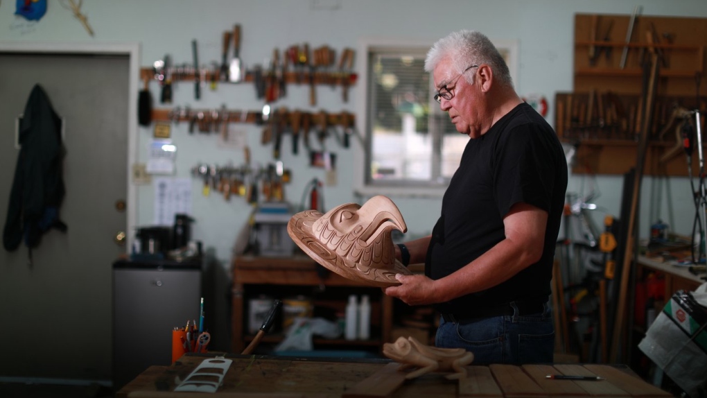 First Nations artist Richard Hunt began carving at the age of 13. Now at 71, he continues to hone his skills as he works on his latest piece, the Sun Mask, using red cedar to create his one of a kind artwork at his studio in Victoria, B.C., June 30, 2022 THE CANADIAN PRESS/Chad Hipolito