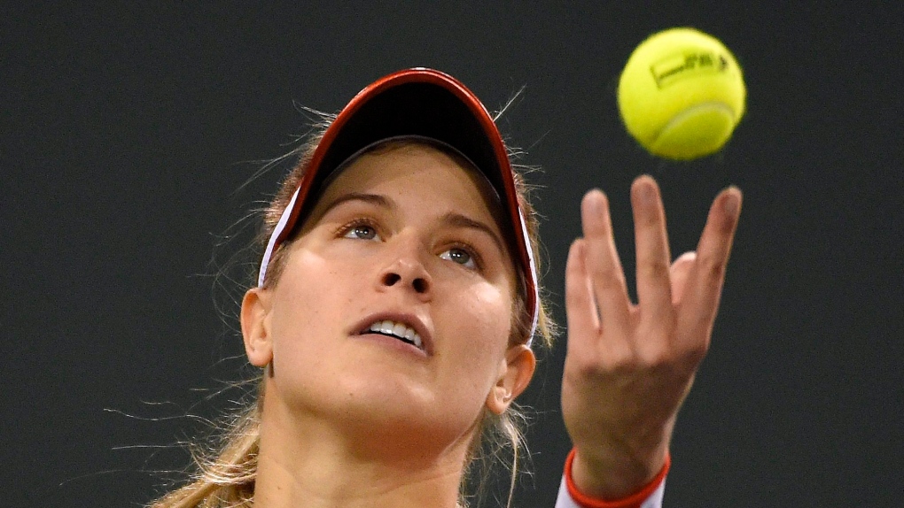 FILE - Eugenie Bouchard, of Canada, serves to Sloane Stephens, of the United States, at the BNP Paribas Open tennis tournament, Saturday, March 12, 2016, in Indian Wells, Calif. (AP Photo/Mark J. Terrill)