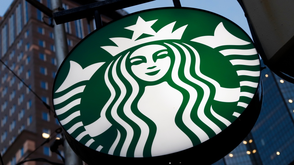 This file photo taken on June 26, 2019, shows a Starbucks sign outside a Starbucks coffee shop in downtown Pittsburgh, Pa. Starbucks is closing 16 stores around the country because of repeated safety issues, including drug use and other disruptive behaviors that threaten staff. (AP Photo/Gene J. Puskar, File)