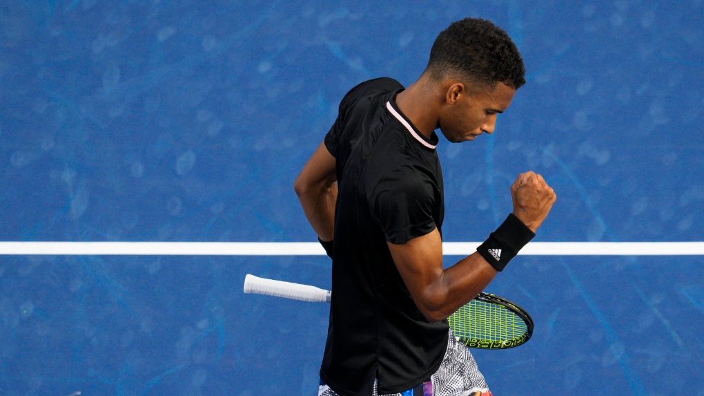 Felix Auger-Aliassime, of Canada, reacts in a match against Jannik Sinner, of Italy, during the Western & Southern Open tennis tournament Thursday, Aug. 18, 2022, in Mason, Ohio. (AP Photo/Jeff Dean)