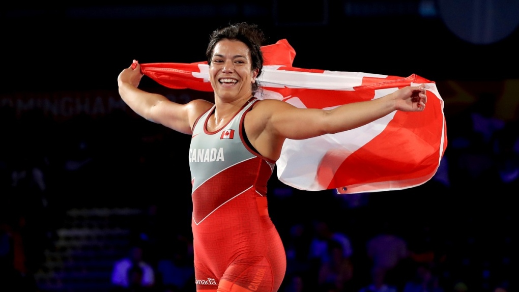 Canada's Justina di Stasio celebrates winning against Nigeria's Hannah Amuchechi Rueben in the women's 76 kilogram gold medal match wrestling at the Coventry Arena on Day 9 of the 2022 Commonwealth Games in Coventry, England, Aug. 6, 2022. (Bradley Collyer/PA via AP)