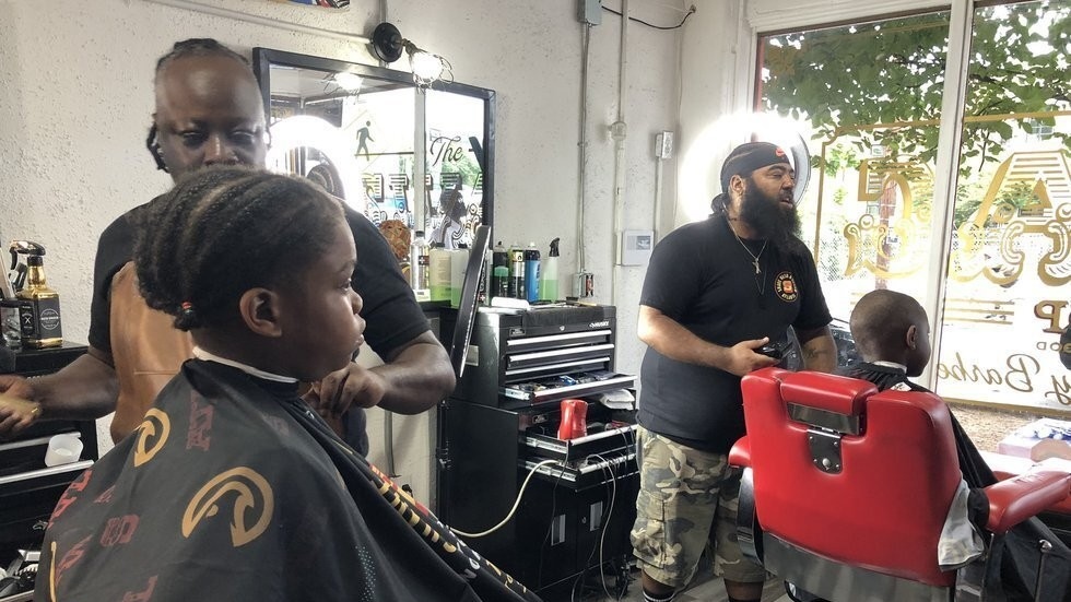 The Witherite Law Group and V-103 teamed up with Rapper Killer Mike's barbershops to get Fulton and DeKalb County kids ready for their first day of school on Monday. (WGCL)