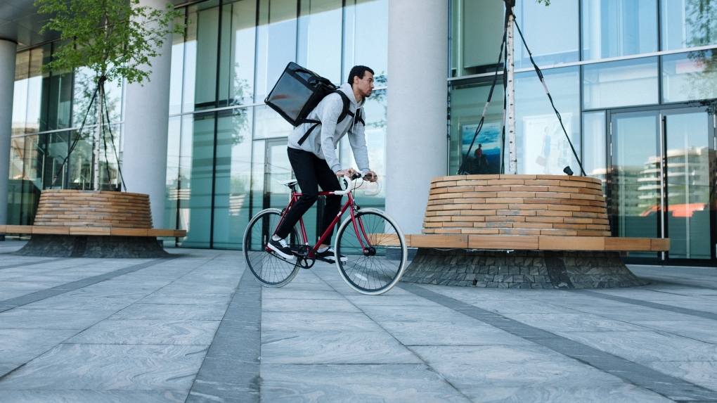 File photo of food delivery person on bicycle. (Cottonbro/Pexels)