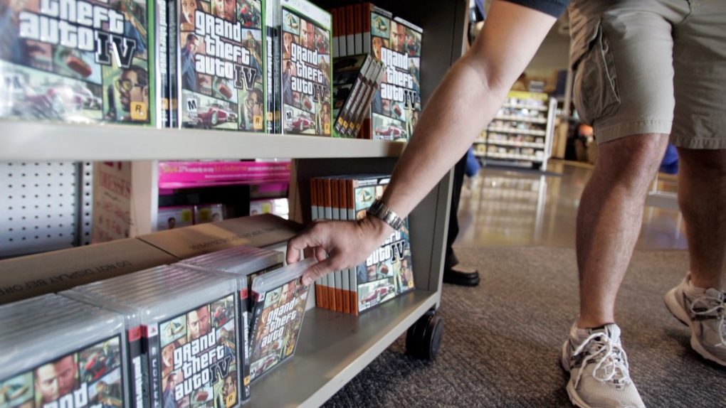 Grabbing a copy of the game Grand Theft Auto IV in Mountain View, Calif., on April 29, 2008. (Paul Sakuma / AP) 