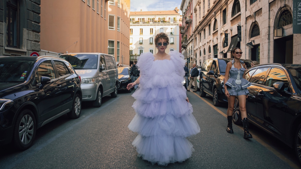 Guests arrive for the Ferretti fashion show, during Milan Fashion Week in Milan, Italy, Wednesday, Sept. 21, 2022. (Claudio Furlan/LaPresse via AP)