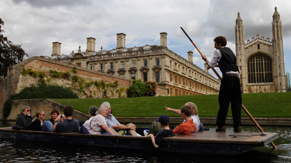 FILE - In this Tuesday Aug. 25, 2009 file photo, tourists enjoy a boat ride on the river Cam, in Cambridge, England. (AP Photo/Lefteris Pitarakis, File)