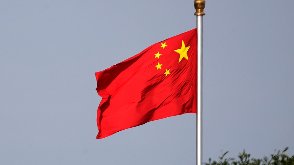 A Chinese national flag flies at Tiananmen Square in Beijing Thursday, June 14, 2018. (AP Photo/Andy Wong, File)