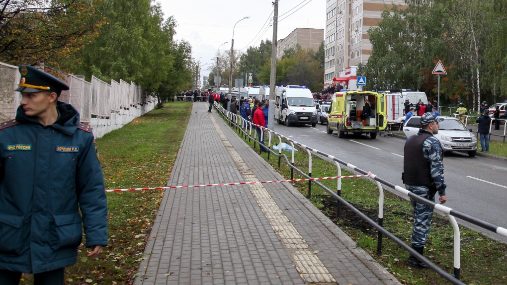 Police block an area as investigators and paramedics work at the scene of a shooting at school No. 88 in Izhevsk, Russia, Monday, Sept. 26, 2022. (AP Photo)