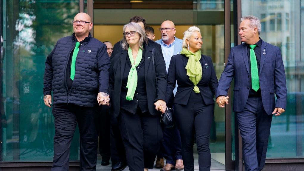 From left, the parents of 19-year-old Harry Dunn, Tim Dunn, father, stepmother Tracey Dunn, Charlotte Charles, mother and stepfather Bruce Charles leave Westminster Magistrates' Court, London, Thursday Sept. 29, 2022, where US citizen Anne Sacoolas, 45, appeared in a British court via videolink. (James Manning/PA via AP)