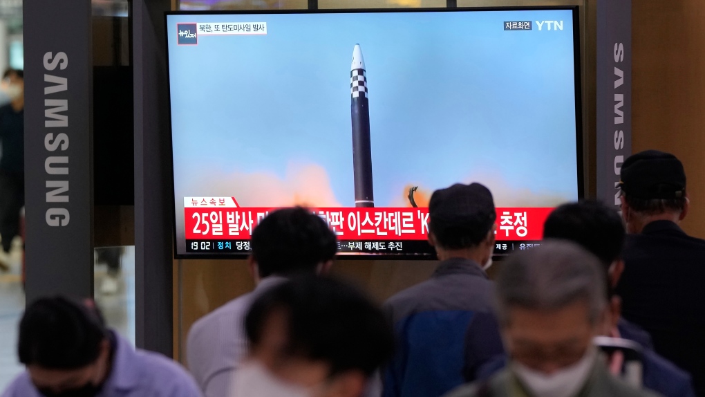 A TV screen shows a file image of a North Korea missile launch during a news program at the Seoul Railway Station in Seoul, South Korea, Wednesday, Sept. 28, 2022. (AP Photo/Ahn Young-joon)