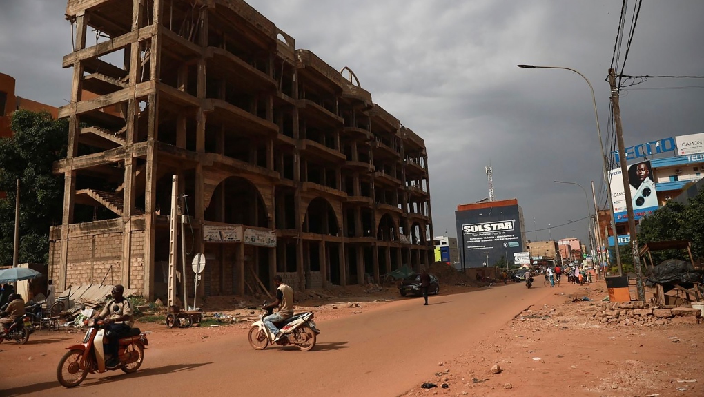 Few venture in the normally busy streets of Burkina Faso's capital Ouagadougou Friday Sept. 30, 2022. (AP Photo/Sophie Garcia)
