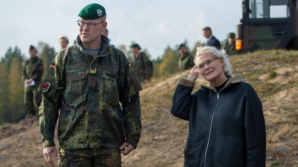 Commander of the German Bundeswehr 41st Mechanized Infantry Brigade Brigadier General Christian Nawrat, left, and German Defence Minister Christine Lambrecht, right, speak during a military exercise at the Gaiziunai training ground some 130 kms (80 miles) west of the capital Vilnius, Lithuania, Oct. 8, 2022. German Defense Minister Christine Lambrecht has resigned following persistent criticism of her handling of military modernization programs and the country’s arms deliveries to Ukraine. Lambrecht said in a statement Monday that she had submitted her resignation request to Chancellor Olaf Scholz. (AP Photo/Mindaugas Kulbis, File)
