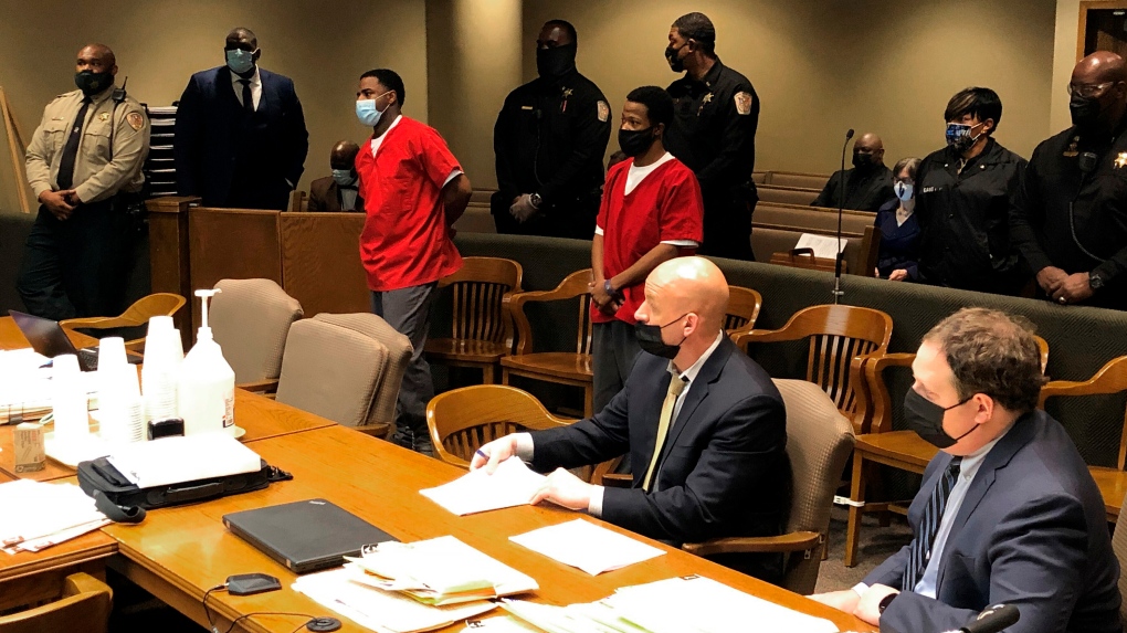 From left, Justin Johnson and Cornelius Smith appear before a judge during a court hearing related to the fatal shooting of rapper Young Dolph on Friday, Feb. 11, 2022, in Memphis, Tenn. (AP Photo/Adrian Sainz).