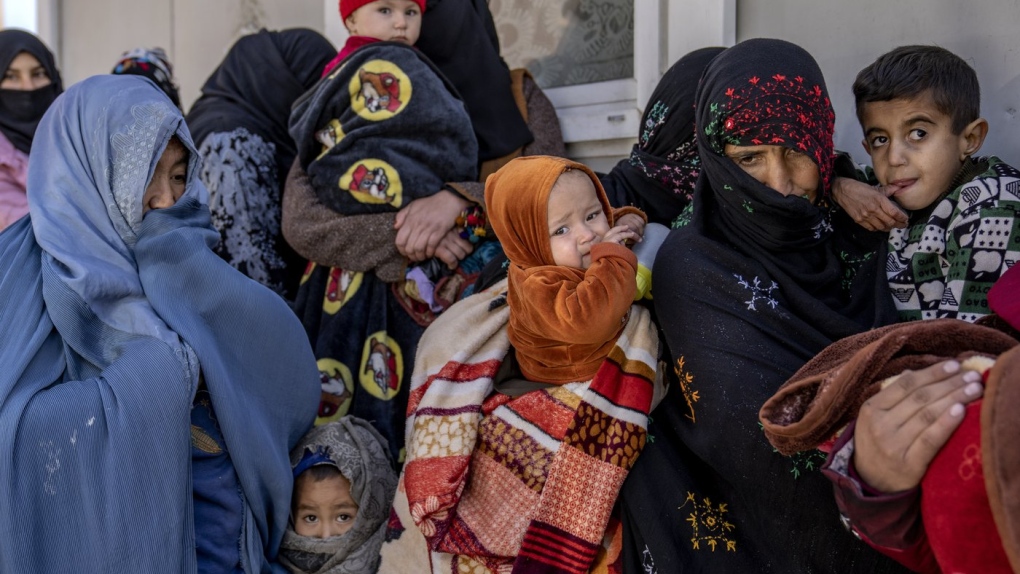 Mothers and babies wait to receive help at a clinic in Kabul, Afghanistan, Jan. 26, 2023. (AP Photo/Ebrahim Noroozi)