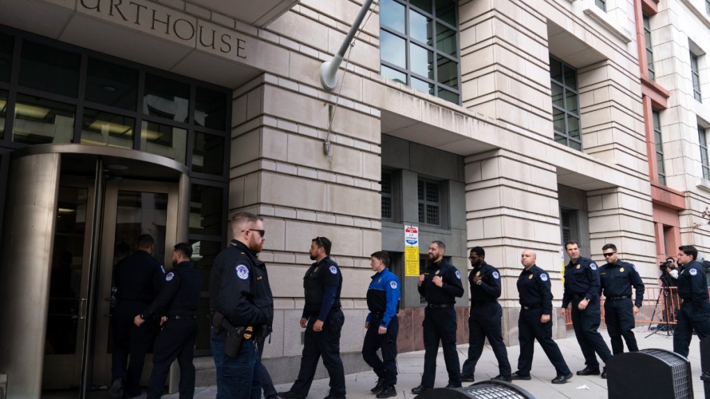 U.S. Capitol police officers arrive for the sentencing of Julian Khater and George Tanios, at the federal courthouse in Washington, Jan. 27, 2023. (AP Photo/Jose Luis Magana)