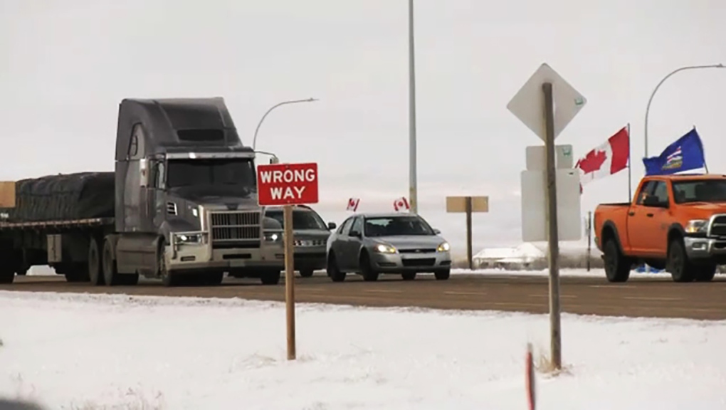 Convoy of Albertans make a 'Coutts Loop' in border town to mark 1-year anniversary of blockade