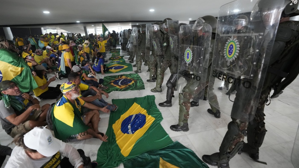 Pro-Bolsonaro protesters storm Brazil government offices, hundreds arrested
