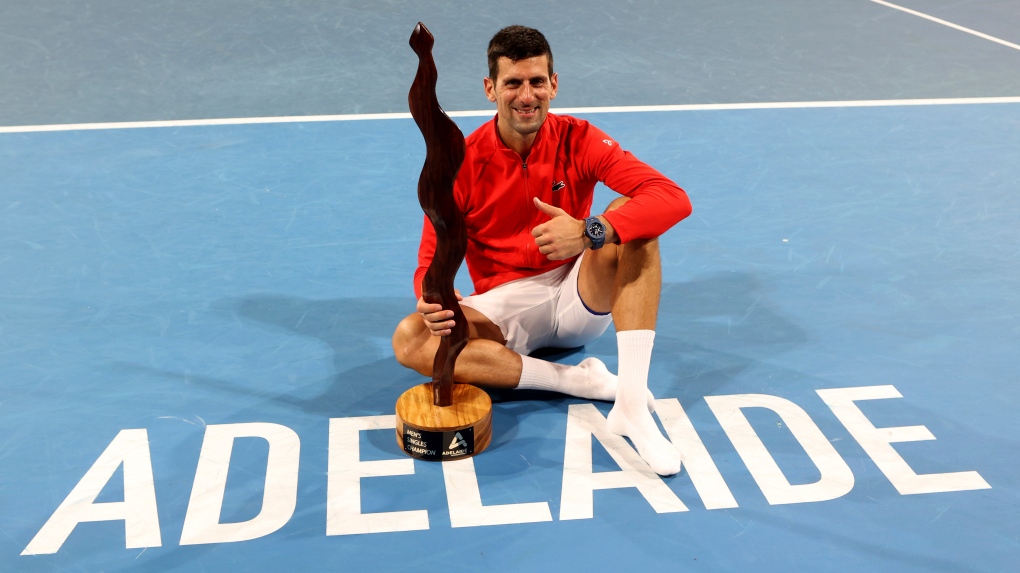Djokovic shrugs off injury scare, wins Adelaide title