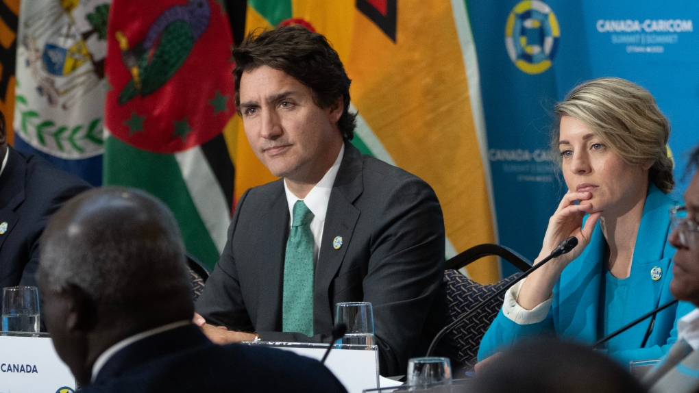 Prime Minister Justin Trudeau and Minister of Foreign Affairs Melanie Joly ilsten to Prime Minister of Trinidad and Tobago Keith Rowley during a working session at the Canada CARICOM Summit, in Ottawa, Wednesday, Oct. 18, 2023. THE CANADIAN PRESS/Adrian Wyld