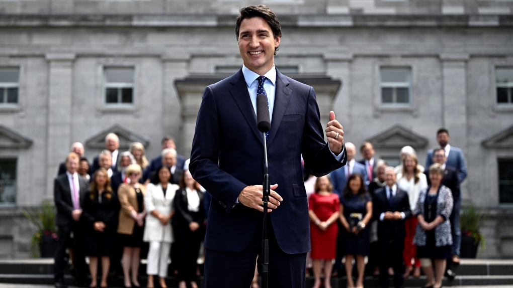 Prime Minister Justin Trudeau gestures towards the federal cabinet as they stand behind him at a media availability after a cabinet shuffle, at Rideau Hall in Ottawa, on Wednesday, July 26, 2023. THE CANADIAN PRESS/Justin Tang