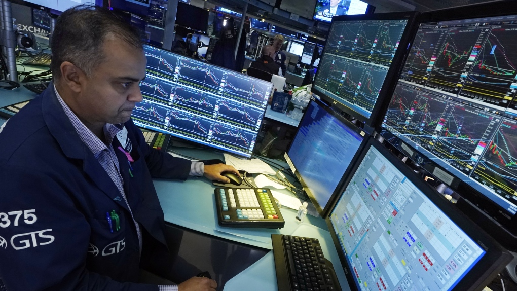 Specialist Dilip Patel works at his post on the floor of the New York Stock Exchange, Tuesday, Oct. 3, 2023. (AP Photo/Richard Drew)