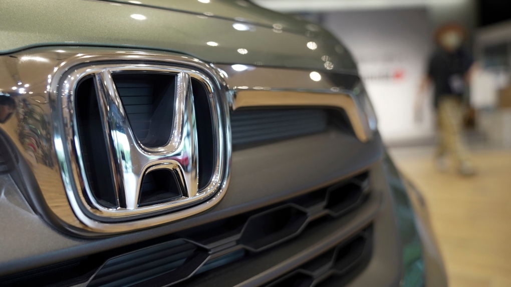 The logo of Honda Motor Company attached to a vehicle is seen at a showroom in Tokyo on May 13, 2022. (AP Photo/Eugene Hoshiko, File)