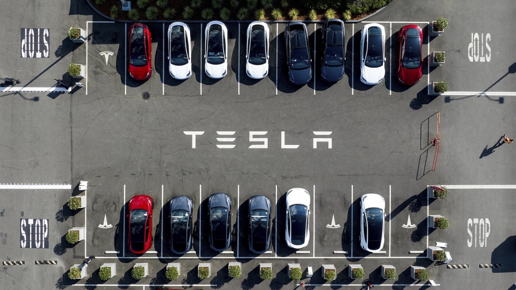 Tesla vehicles line a parking lot at the company's Fremont, Calif., factory, on Sept. 18, 2023. (AP Photo/Noah Berger, File)