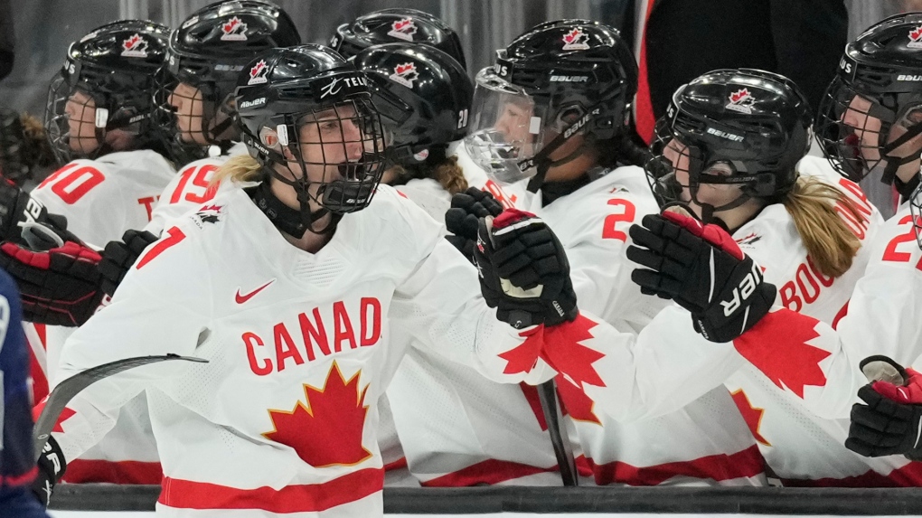 Canada forward Laura Stacey (7) celebrates with teammates after scoring during the second period of a rivalry series women's hockey game against the United States Saturday, Nov. 11, 2023, in Los Angeles. (AP Photo/Ashley Landis)