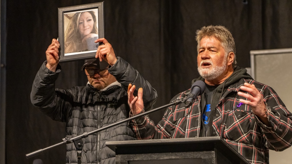 Brian Sweeney, right, father of shooting victim Angie Sweeney, speaks on stage during a candlelight vigil, in Sault Ste. Marie, Ont., Friday, Oct. 27, 2023. THE CANADIAN PRESS/Robert Davies