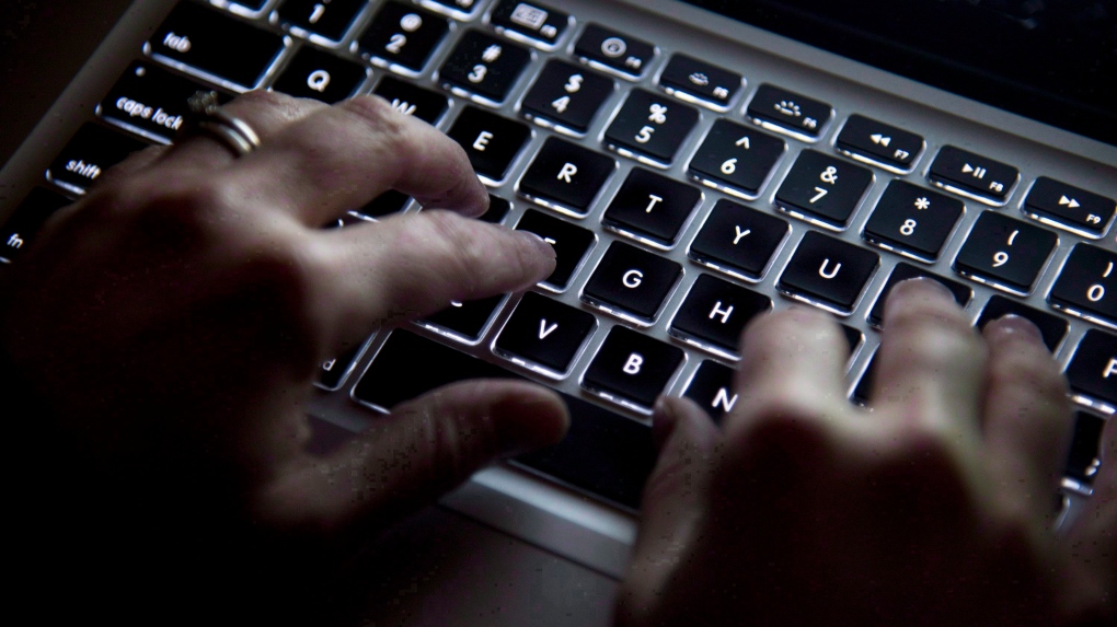 A woman uses a keyboard in North Vancouver, B.C., Wednesday, December 19, 2012. THE CANADIAN PRESS/Jonathan Hayward