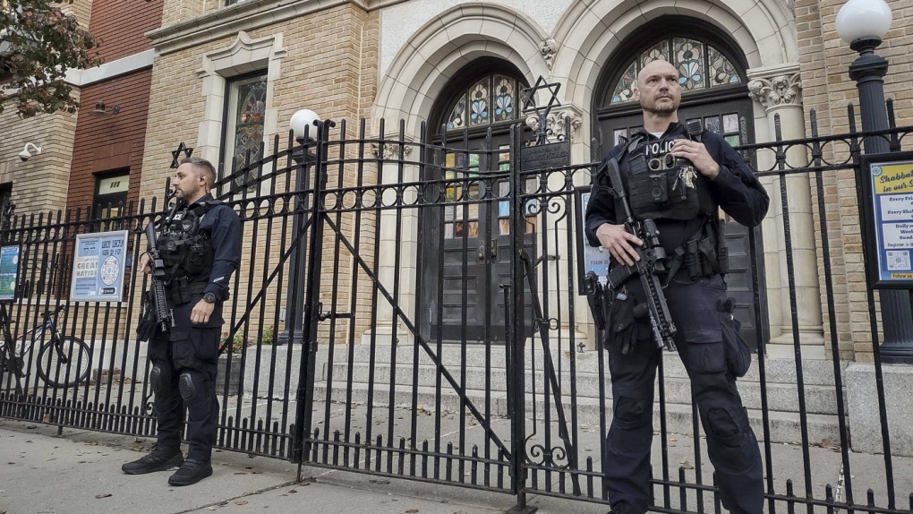 Hoboken Police officers stand watch outside the United Synagogue of Hoboken, Nov. 3, 2022, in Hoboken, N.J. (AP Photo/Ryan Kryska, File)