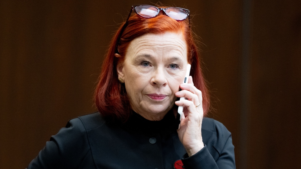 Catherine Tait, President and CEO of the Canadian Broadcasting Corporation (CBC) talks on the phone before appearing at the Standing Committee on Canadian Heritage in Ottawa, on Thursday, Nov. 2, 2023. THE CANADIAN PRESS/Spencer Colby