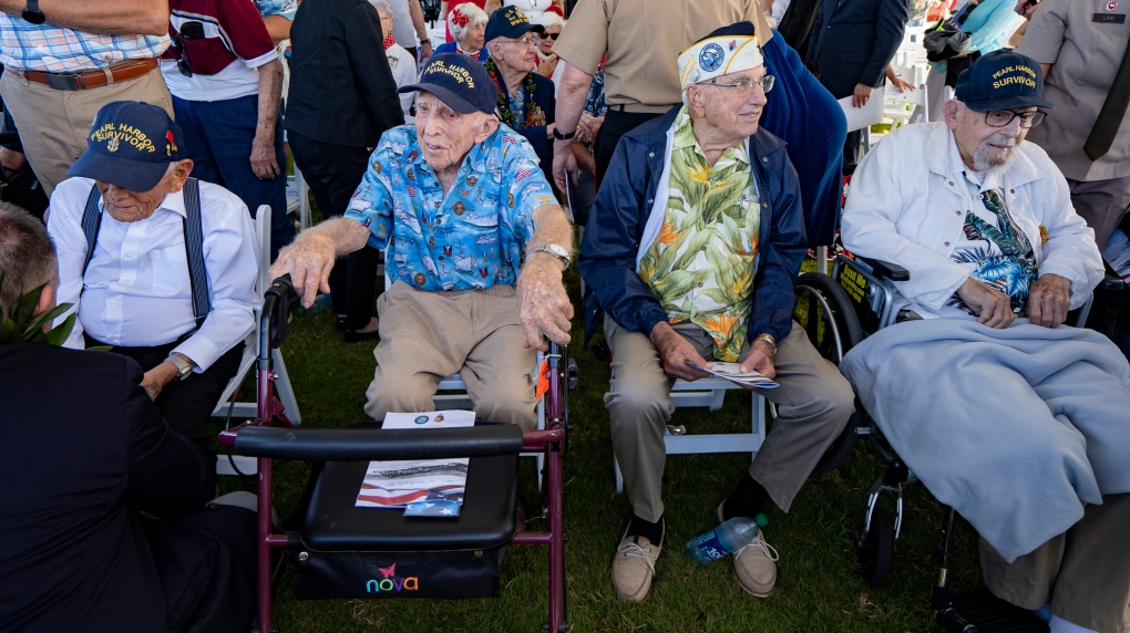 From left to right, Pearl Harbor survivors Harry Chandler, Ken Stevens, Herb Elfring and Ira "Ike" Schab during the 82nd Pearl Harbor Remembrance Day ceremony on Thursday, Dec. 7, 2023, at Pearl Harbor in Honolulu, Hawaii. (AP Photo/Mengshin Lin) 