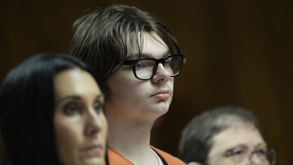 Ethan Crumbley stands with his attorneys, Paulette Loftin and Amy Hopp, during his hearing at Oakland County Circuit Court, Aug. 1, 2023, in Pontiac, Mich. (Clarence Tabb Jr./Detroit News via AP, Pool, File)
