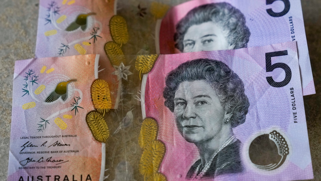 Australian $5 notes are pictured in Sydney on Sept. 10, 2022. (AP Photo/Mark Baker, File)