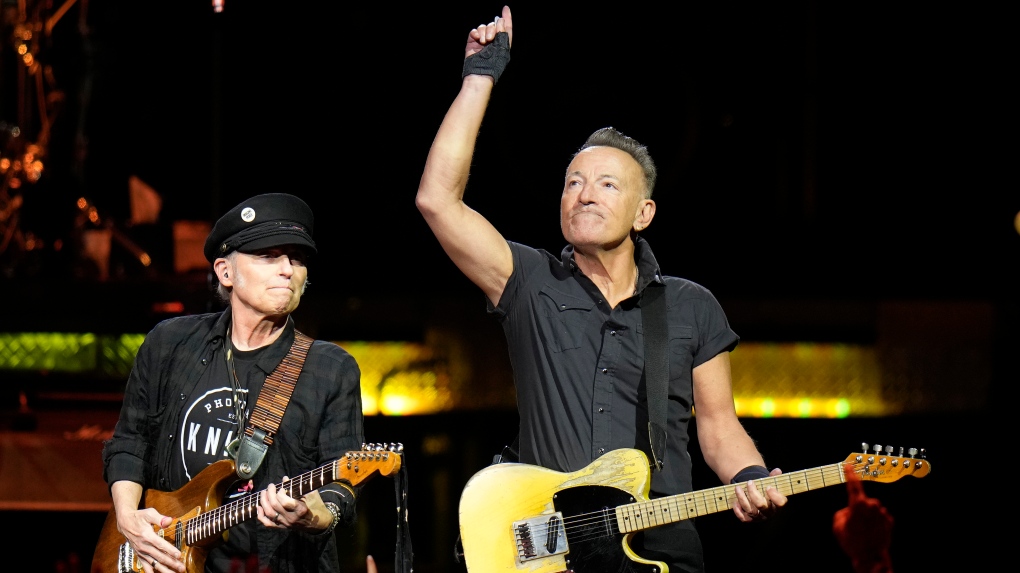 Singer Bruce Springsteen, right, and E Street Band member Nils Lofgren perform during their 2023 tour Wednesday, Feb. 1, 2023, at Amalie Arena in Tampa, Fla. (AP Photo/Chris O'Meara)