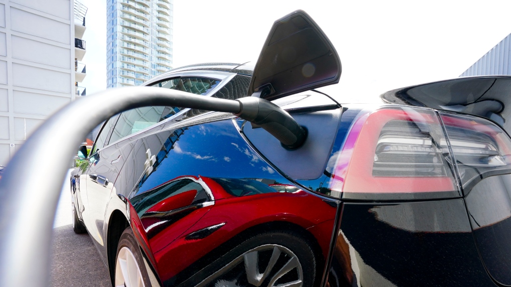 An electric vehicle is charged in Ottawa on Wednesday, July 13, 2022. THE CANADIAN PRESS/Sean Kilpatrick 