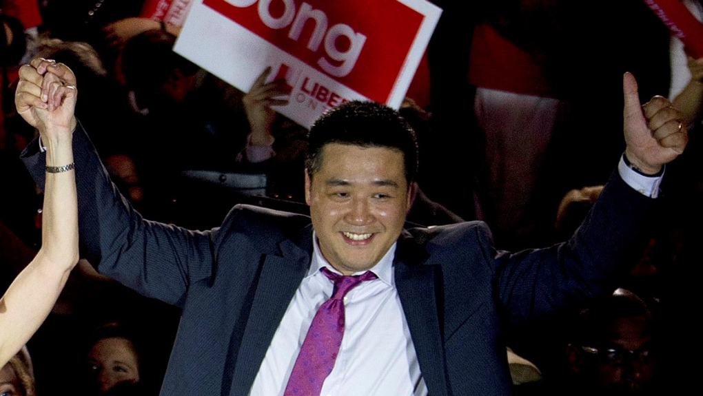 Candidate Han Dong celebrates with supporters while taking part in a rally in Toronto on Thursday, May 22, 2014.  THE CANADIAN PRESS/Nathan Denette