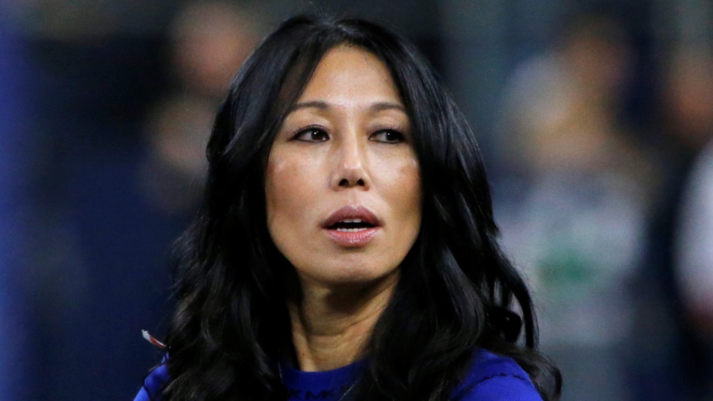 Buffalo Bills co-owner Kim Pegula stands on the field before an NFL football game, in Arlington, Texas, on Nov. 28, 2019. (AP Photo/Michael Ainsworth, File) 