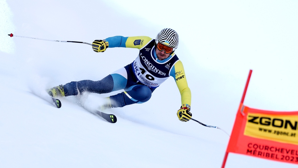 Ukraine's Ivan Kovbasnyuk speeds down the course during the super G portion of an alpine ski, men's World Championship combined race, in Courchevel, France, Tuesday, Feb. 7, 2023. (AP Photo/Gabriele Facciotti) 