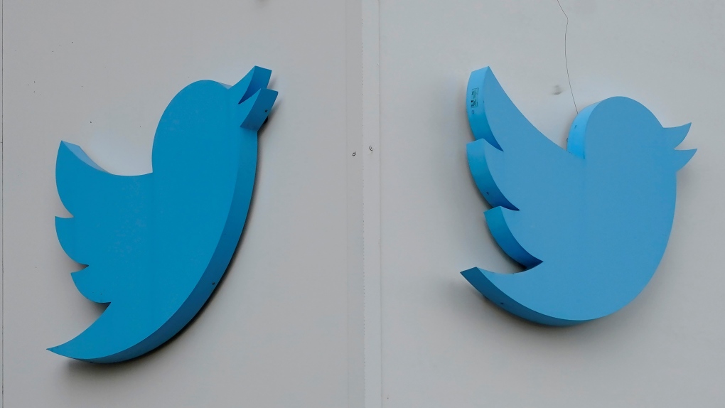 Twitter logos hang outside the company's offices in San Francisco, Monday, Dec. 19, 2022. (AP Photo/Jeff Chiu) 