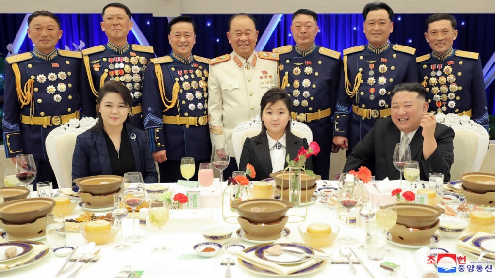 North Korean leader Kim Jong Un, front right, with his wife Ri Sol Ju, front left, and his daughter poses with military top officials, on Feb. 7, 2023. (Korean Central News Agency / Korea News Service via AP) 