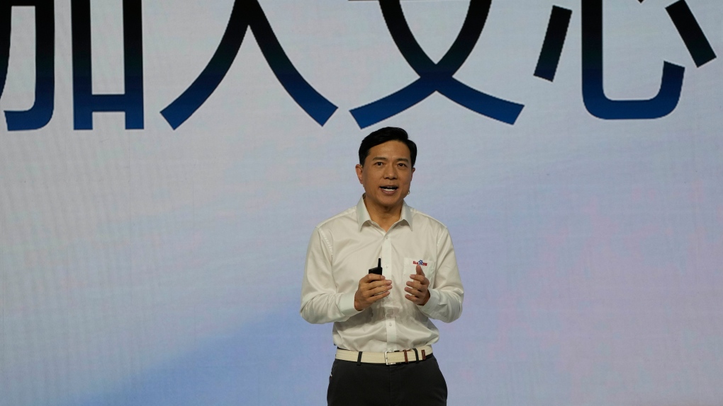 Baidu CEO Robin Li introduces the functions of Ernie Bot below the words for "Join Ernie Bot" during an event in Beijing, March 16, 2023. (AP Photo/Ng Han Guan)